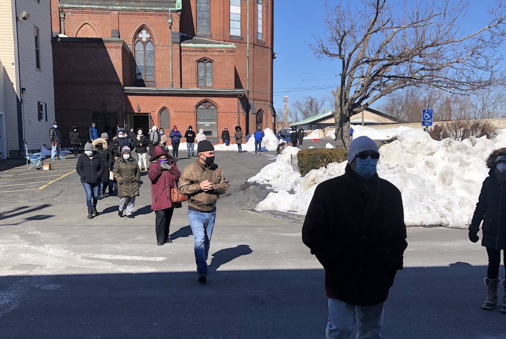 Parishioners walk on the snow-cleared parking lot of St. Patrick Church in Lawrence, Massachusetts, to assemble in winter for Mass outdoors. (Courtesy of St. Patrick Parish) Parishioners walk on the snow-cleared parking lot of St. Patrick Church in Lawrence, Massachusetts, to assemble in winter for Mass outdoors. (Courtesy of St. Patrick Parish)